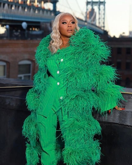 Claire Sulmers in a blonde wig from Justine Skye’s new collection